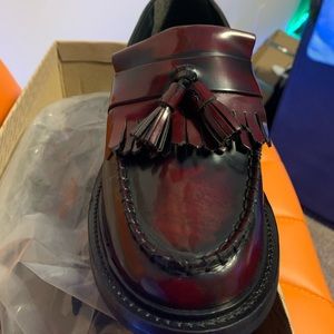 Brand new. Never worn, slight wide fit.